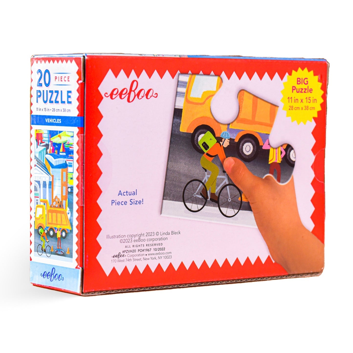 The Eeboo "Vehicles" 20-piece jigsaw puzzle features a vibrant city of vehicles-themed image with a hand placing a puzzle piece. The box measures 11 inches by 15 inches (28 cm by 38 cm) and prominently displays "Actual Piece Size!" on the front, making it an excellent tool for enhancing hand-eye coordination.