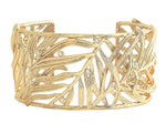 The Anabel Aram Palm Leaves Cuff is an 18k gold-dipped bracelet with an openwork palm frond design and sparkling hand-set crystals.