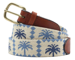 The Smathers & Branson Palms Belt features a beige hand-stitched design with blue palm trees, brown Italian leather accents, and a brass buckle.