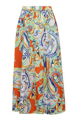 The Hunter Bell Tatum Skirt by Hunter Bell NYC is a colorful midi skirt with a vibrant paisley and floral pattern in orange, blue, green, and white, reminiscent of Amalfi Tiles print. It features an elastic waistband for comfort and ease.