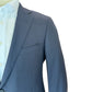 A close-up of a person wearing a navy Samuelsohn Bennet Contemporary Fit Suit jacket over a white dress shirt, shown from the chest up against a white background.
