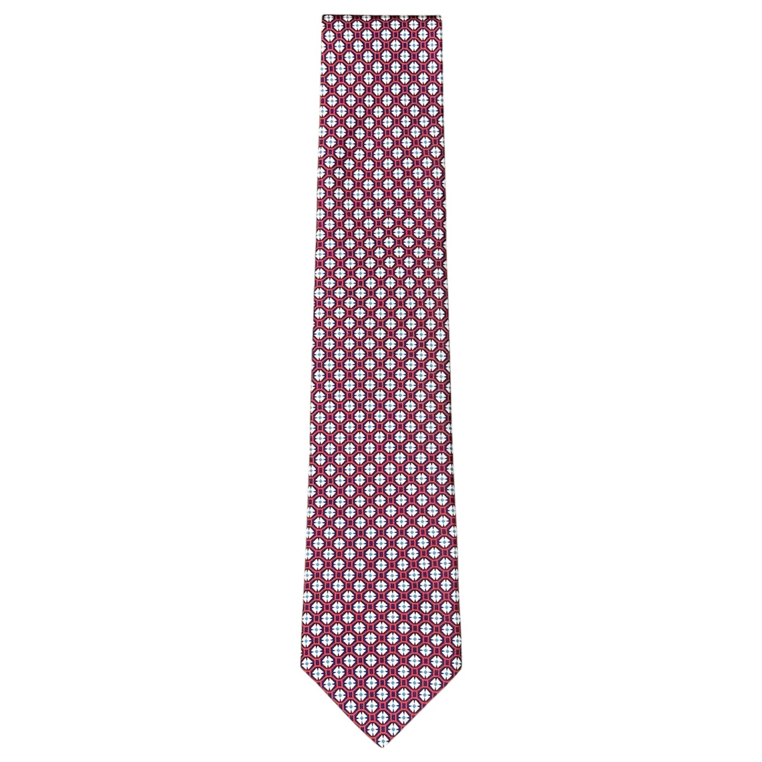 The Maltese Cross Tie by Robert Jensen is hand-stitched in Italy from red silk, featuring a repeating pattern of small white and blue circular shapes.