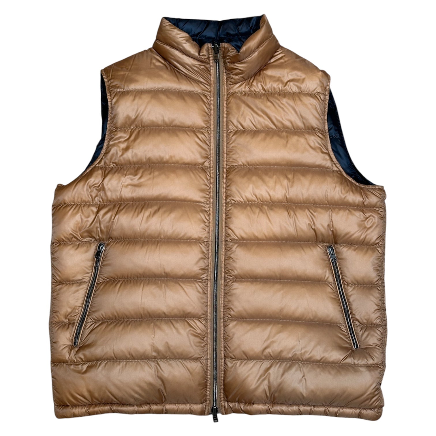 The Herno Ultralight Nylon Reversible Vest features a tan design with a high collar, front zipper closure, and two zippered side pockets. Crafted from lightweight nylon and filled with goose down, it's showcased on a white background.