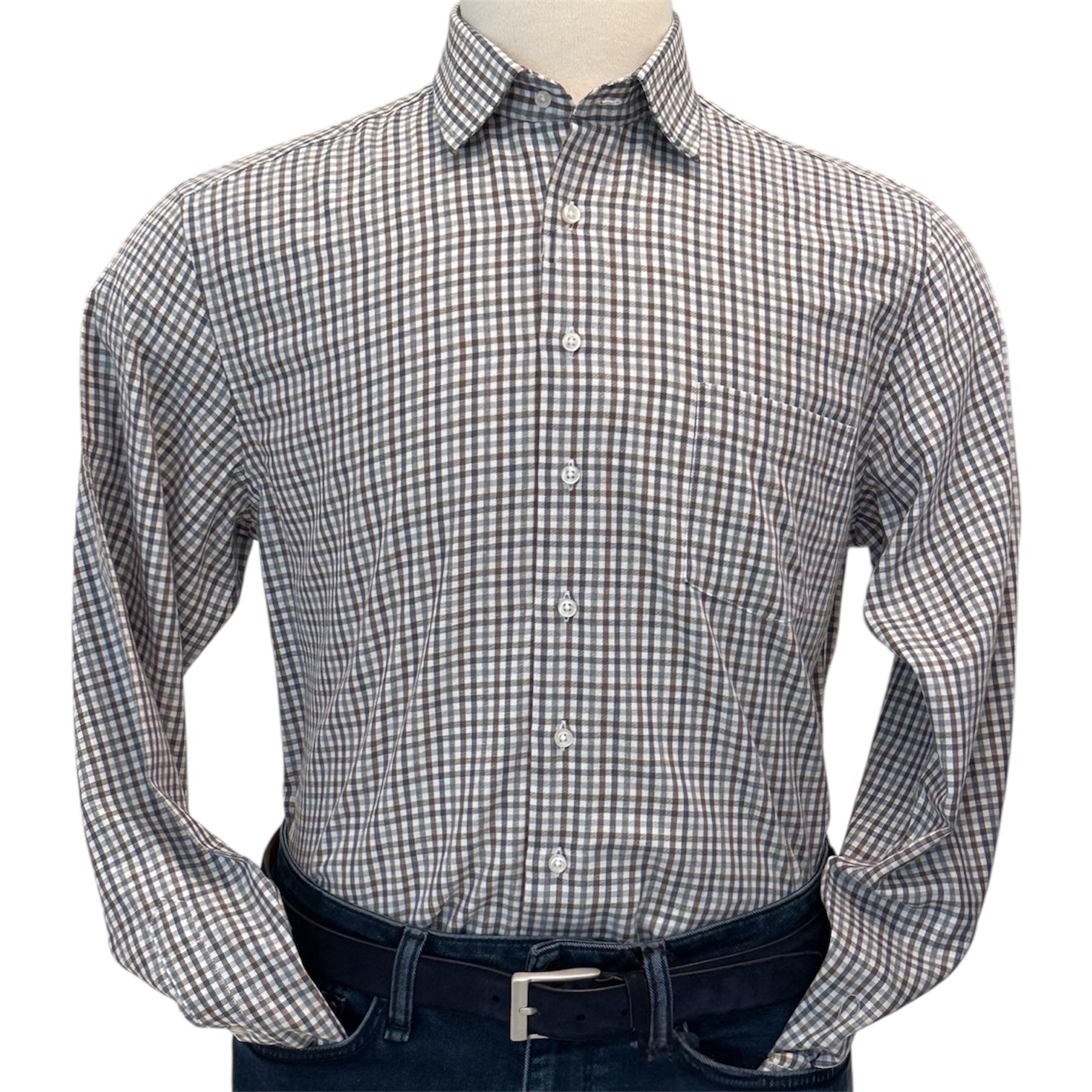 A mannequin wears the Alan Paine Dunsdale Woven Shirt, featuring long sleeves and a small brown and white check pattern, tucked into dark blue jeans with a black belt.