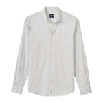 The Johnnie-O Paddock Button Down is a long-sleeve performance shirt with a light blue and yellow checkered pattern, pointed collar, and front pocket, shown flat on a white background.