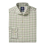 The Peirce Buttondown by Johnnie-O is a folded long-sleeve premium cotton shirt with a green and white plaid pattern, cutaway collar, front pocket, and cream-colored buttons.