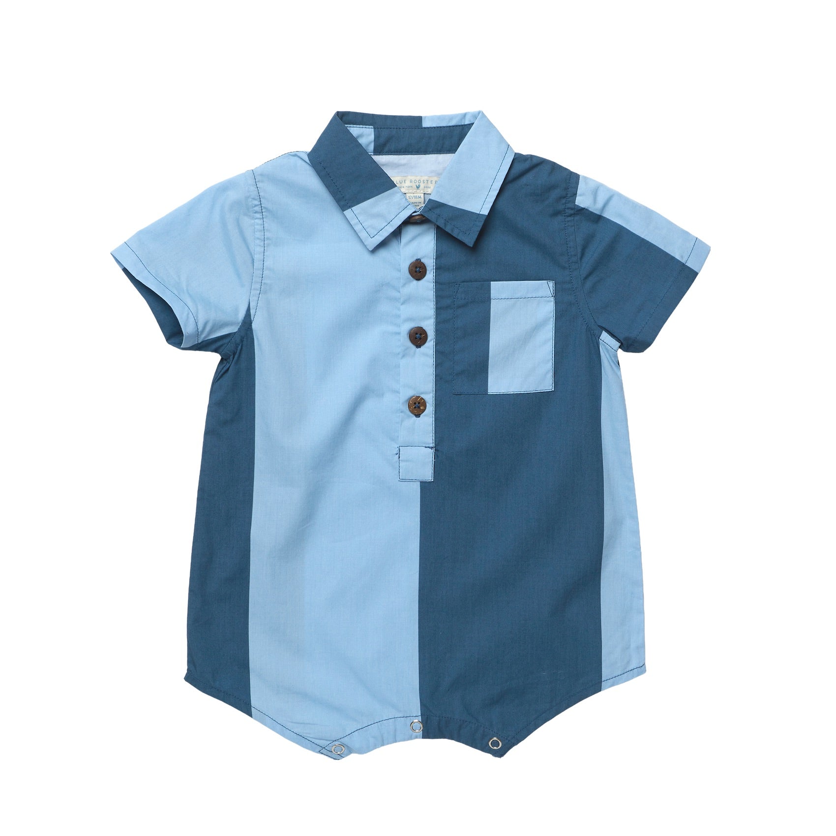 The Pink Chicken Baby Boys' Easton Jumper is a cotton one piece with a blue colorblock design, short sleeves, front buttons, chest pocket, and snap closures—ideal for warm days.