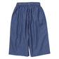 Girls’ Bailey Ruffle Pant by Pink Chicken in blue chambray, featuring wide legs and an elastic waistband, displayed flat on a white background.