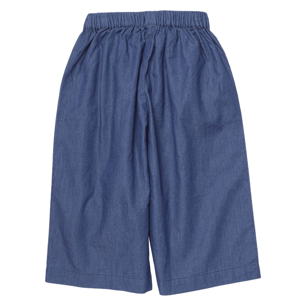 Girls’ Bailey Ruffle Pant by Pink Chicken in blue chambray, featuring wide legs and an elastic waistband, displayed flat on a white background.