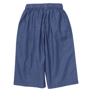 Girls’ Bailey Ruffle Pant by Pink Chicken in blue chambray, featuring wide legs and an elastic waistband, displayed flat on a white background.