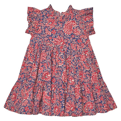The Girls’ Jennifer Dress by Pink Chicken features short sleeves, ruffled details, and a tiered skirt, adorned with a red and white paisley vines pattern on a blue background—making it the perfect charming fall dress.
