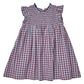 Girls’ Stevie Dress by Pink Chicken featuring a charming red & blue check plaid pattern, smocked bodice, ruffled collar, and flutter sleeves.
