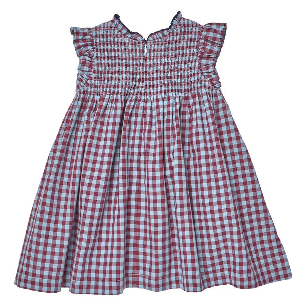Pink Chicken Girls’ Stevie Dress in red and white plaid, featuring a smocked bodice, ruffled cap sleeves, and a flared skirt, displayed on a plain white background.