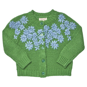 The Girls’ Blossom Sweater by Pink Chicken is a green button-down cardigan for girls, featuring blue floral embroidery on the front, four coordinating green buttons, and long sleeves.