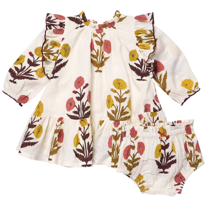 The Baby Girls’ Harper Dress Set by Pink Chicken features long sleeves, ruffles, bloomers, and a Harvest Dandelion floral print—perfect for fall.