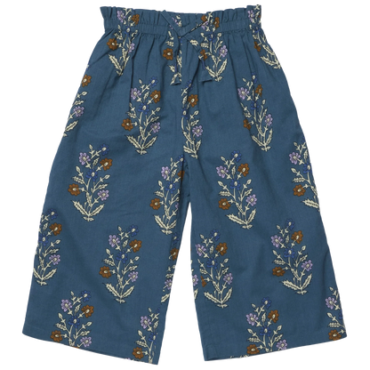 Girls’ Theodore Pant by Pink Chicken with paperbag elastic waist, front drawstring, and floral print in brown, white, purple, and green.