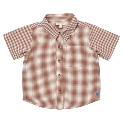 The Pink Chicken Boys' Jack Shirt in Cocoa Gingham features short sleeves, a collar, brown and white checkered pattern, and a blue heart logo on the lower right side.