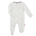 The Magnetic Me Pink Little Bitty Pretty One Footie is a white baby onesie adorned with a pastel animal print. It features long sleeves and integrated feet, crafted from eco-friendly TENCEL™ modal, and is designed with SewSafe™ magnetic closures for easy changing.