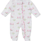 The Kissy Kissy Fairway Foursome Printed Zip Footie is a white onesie made from soft Pima cotton, featuring delightful pink and green golf-themed prints, a front ruffle trim, and a cozy footie design. Perfect for your little one!.