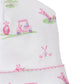 The Kissy Kissy Fairway Foursome Printed Hat, from brand Kissy Kissy, is a white baby hat made of 100% Pima cotton. It showcases pink and green golf-themed illustrations with golf carts, clubs, and balls on grass.