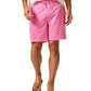 A person wearing Johnnie-O Tickled Pink Swim Trunks, a white shirt, and brown sandals.