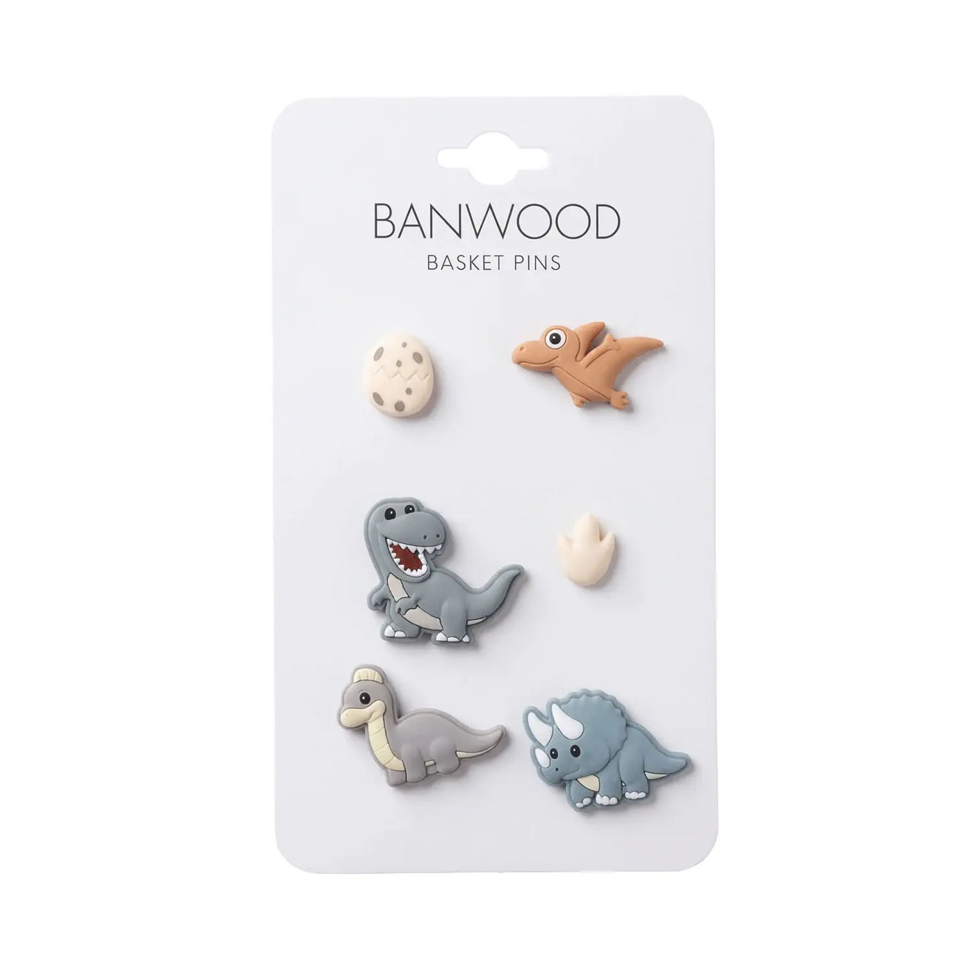 A set of six Banwood Kids’ Bike Basket Pins, including four dinosaur shapes, one egg, and one dinosaur footprint on a white card—perfect for decorating your Pin & Ride Baskets.