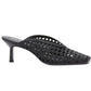 The 3.1 Phillip Lim ID Macrame Mule features a pointed toe, mid stiletto heel, handwoven faux leather, and an open-back architectural design.