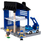 Introducing the BRIO World Police Station by Brio: a toy playset that includes a blue parking garage, a toy tow truck, two small toy figures, and a miniature police van ready to maintain law and order.