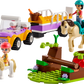 Lego set displaying two figures riding horses along with a purple and yellow vehicle. The small green playset includes a tree, stream, and comes with the LEGO® Friends Horse and Pony Trailer by Legos - Toyhouse for your riding trip adventure.