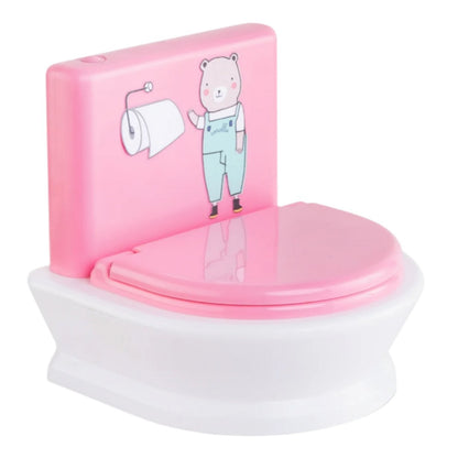 The Corolle Interactive Toilet from the Mon Grand Poupon Corolle Collection showcases a charming pink and white design, adorned with a cartoon bear and equipped with a paper roll on the backrest, making it an ideal addition for your baby doll's playtime adventures.