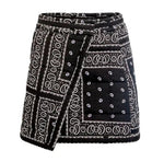 The Powell Skirt by Hunter Bell NYC is a black and white wrap silhouette with a patchwork bandana print and front square pocket—an effortless statement piece for your wardrobe.