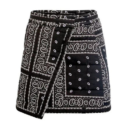 The Powell Skirt by Hunter Bell NYC is a black and white wrap silhouette with a patchwork bandana print and front square pocket—an effortless statement piece for your wardrobe.