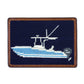Smathers & Branson’s Card Wallet features a rectangular needlepoint design with hand-stitched blue and white boat imagery on a navy background, accented by brown leather trim. This wallet blends nautical-inspired style with classic craftsmanship.