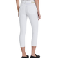 A person standing against a plain background, wearing white AG Jeans Prima Crop Luscious Super Stretch Sateen cigarette pants and black slip-on shoes.