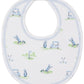 The Kissy Kissy Fairway Foursome Printed Bib by Kissy Kissy features a charming golf-themed print with carts, clubs, and flags on a white background with blue trim. Made from soft Pima cotton, it's perfect for comfy baby mealtime.