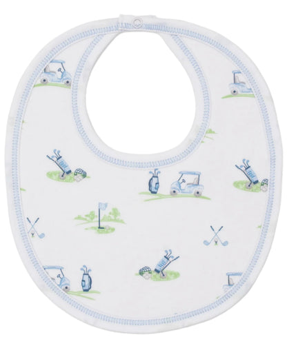 The Kissy Kissy Fairway Foursome Printed Bib by Kissy Kissy features a charming golf-themed print with carts, clubs, and flags on a white background with blue trim. Made from soft Pima cotton, it's perfect for comfy baby mealtime.