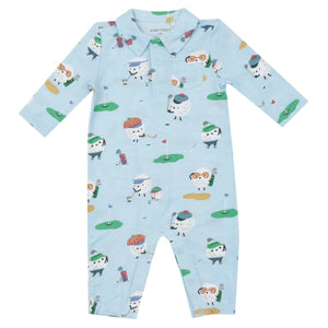 The Angel Dear Golf Club Pro Polo Romper by Angel Dear is a blue long-sleeve infant onesie featuring a golfing-themed print with playful characters, a small chest pocket, and snap buttons along the legs. It is crafted from soft bamboo viscose with a touch of spandex for added comfort.