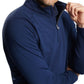 A Peter Millar enthusiast confidently crosses their arms while sporting a partially unzipped Excursionist Flex Performance Pullover in navy blue.