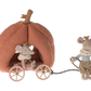 The Maileg Pumpkin Carriage, Mouse from Maileg features two intricately detailed plush toy mice. One mouse, wearing a crown, stands and pulls the pumpkin-shaped carriage while the other crowned mouse sits inside. This whimsical fairytale toy is perfect for kids.