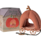 A small Maileg Pumpkin Carriage, Mouse with wheels is shown next to a decorative box labeled "Royal Pumpkin Carriage." The plush pink interior and fairytale design make it a charming toy for kids, resembling a delightful royal mice carriage by Maileg.