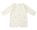 The Quincy Mae Baby Long Sleeve Romper features a cream color with small bears, trees, and crescent moons in muted tones—ideal for everyday wear and easy changing.