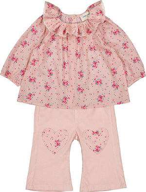 The Baby Girls' Holly Corduroy Trousers by Louis Louise, featuring an elastic waistband and heart-shaped knee patches, pair perfectly with a pink floral long-sleeve top with a ruffled collar for young children.
