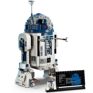A detailed LEGO® Star Wars™ R2-D2 model from Legos - Toyhouse, featuring the iconic droid with a display plaque and a mini figurine at the base.
