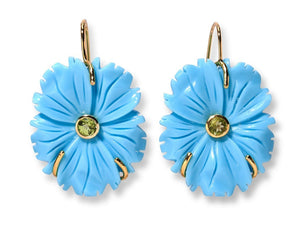 The New Bloom Earrings by Lizzie Fortunato feature gold-plated brass, blue mother-of-pearl flower blooms with green gemstone centers, and gold hooks.