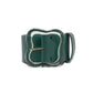 The Lizzie Fortunato Florence Belt by Lizzie Fortunato showcases a green leather design, complemented by a sleek clover-inspired buckle and a single belt loop.