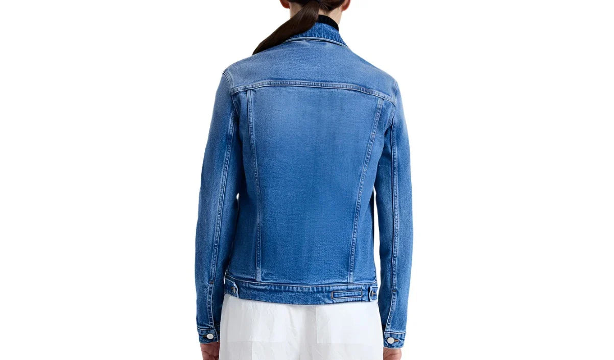 A person is seen from the back wearing a Newman Jacket by Proenza Schouler White Label with a white skirt against a plain white background.