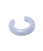 The Lizzie Fortunato Ridge Cuff is a thick, translucent light purple resin bracelet with a glossy finish, ideal for stacking with other bracelets and shown on a white background.