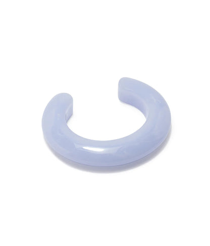 The Lizzie Fortunato Ridge Cuff is a thick, translucent light purple resin bracelet with a glossy finish, ideal for stacking with other bracelets and shown on a white background.