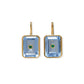 The Tile Earrings by Lizzie Fortunato feature gold-plated brass with rectangular blue gemstones and a central semiprecious rhodolite accent.
