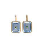 The Tile Earrings by Lizzie Fortunato feature gold-plated brass with rectangular blue gemstones and a central semiprecious rhodolite accent.